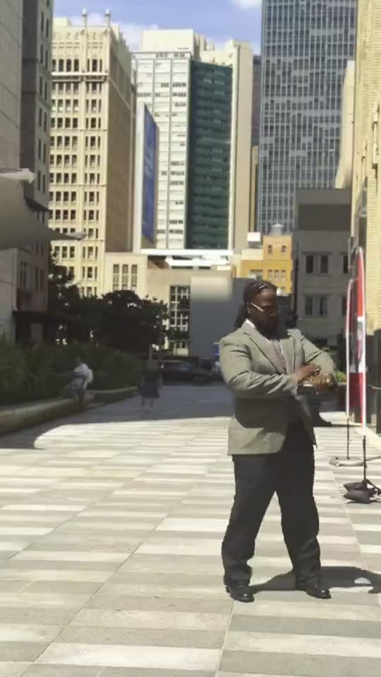 Que Heffe in a suit in downtown Los Angeles